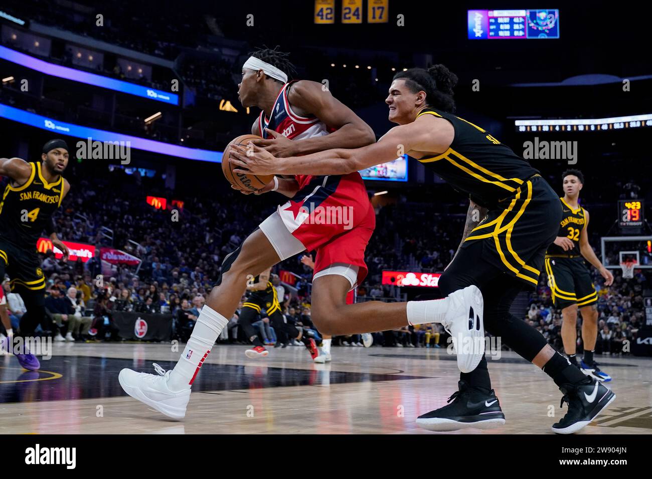 Golden State Warriors forward Gui Santos, right, pokes the ball away