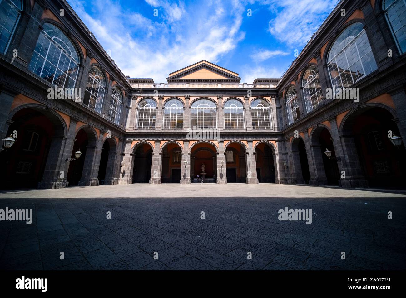 Inner courtyard of the Royal Palace of Naples, Palazzo Reale di Napoli, a historical tourist destination located in central Naples. Stock Photo