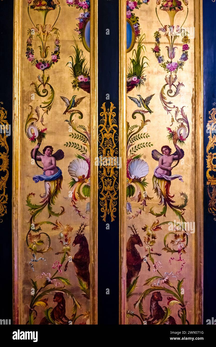 Artfully painted door inside the Royal Palace of Naples, Palazzo Reale di Napoli, a historical tourist destination located in central Naples. Stock Photo