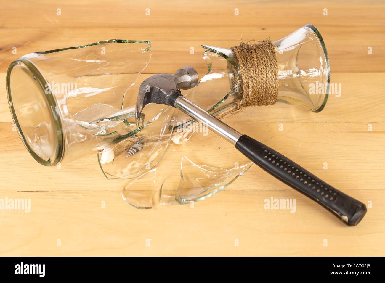 Glass vase smashed with a metal hammer Stock Photo Alamy