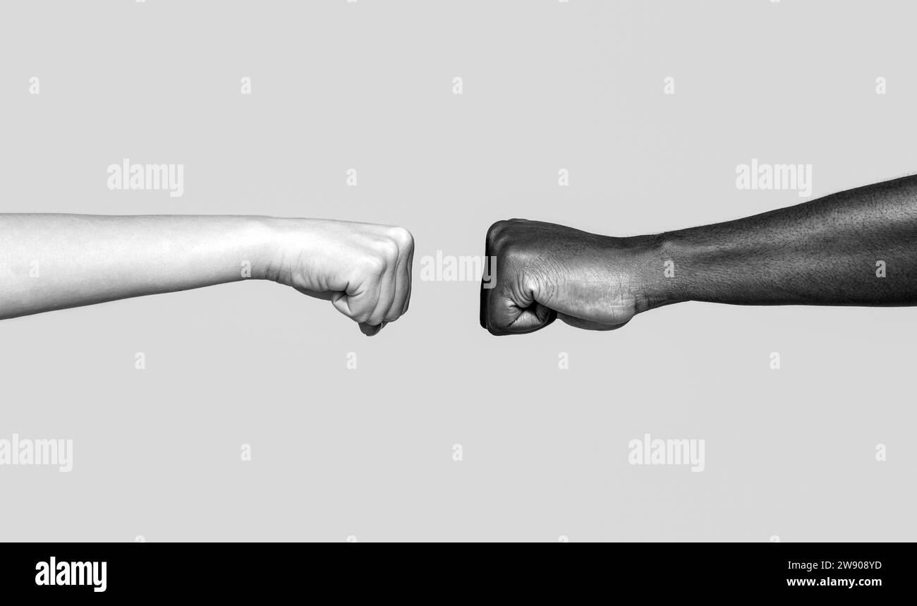 Black African American race male and woman hands giving a fist bump. Friendship, team, good work. Multicultural friends giving fist bump to each other Stock Photo