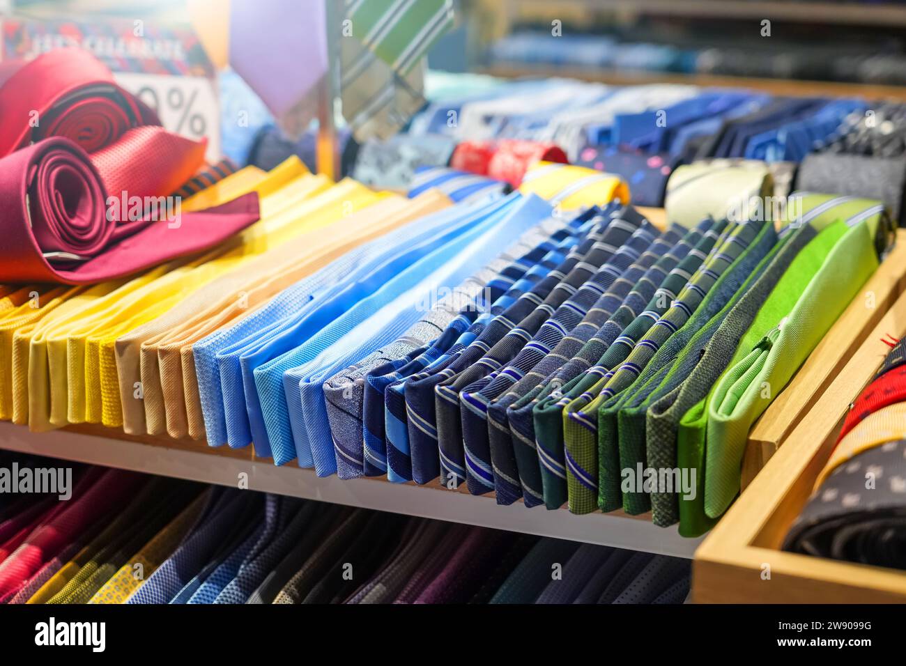 Ties of shade and colorful tones with strict design pattern are folded ...