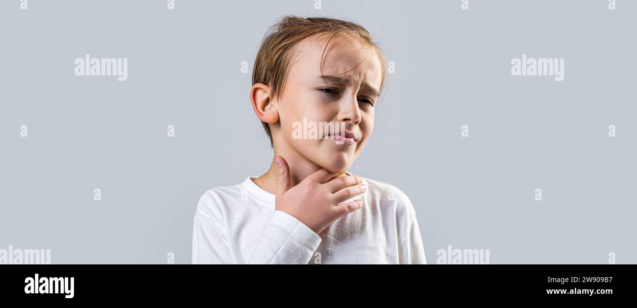 Ill little boy with sore throat. Ill child with sore throat. Sore