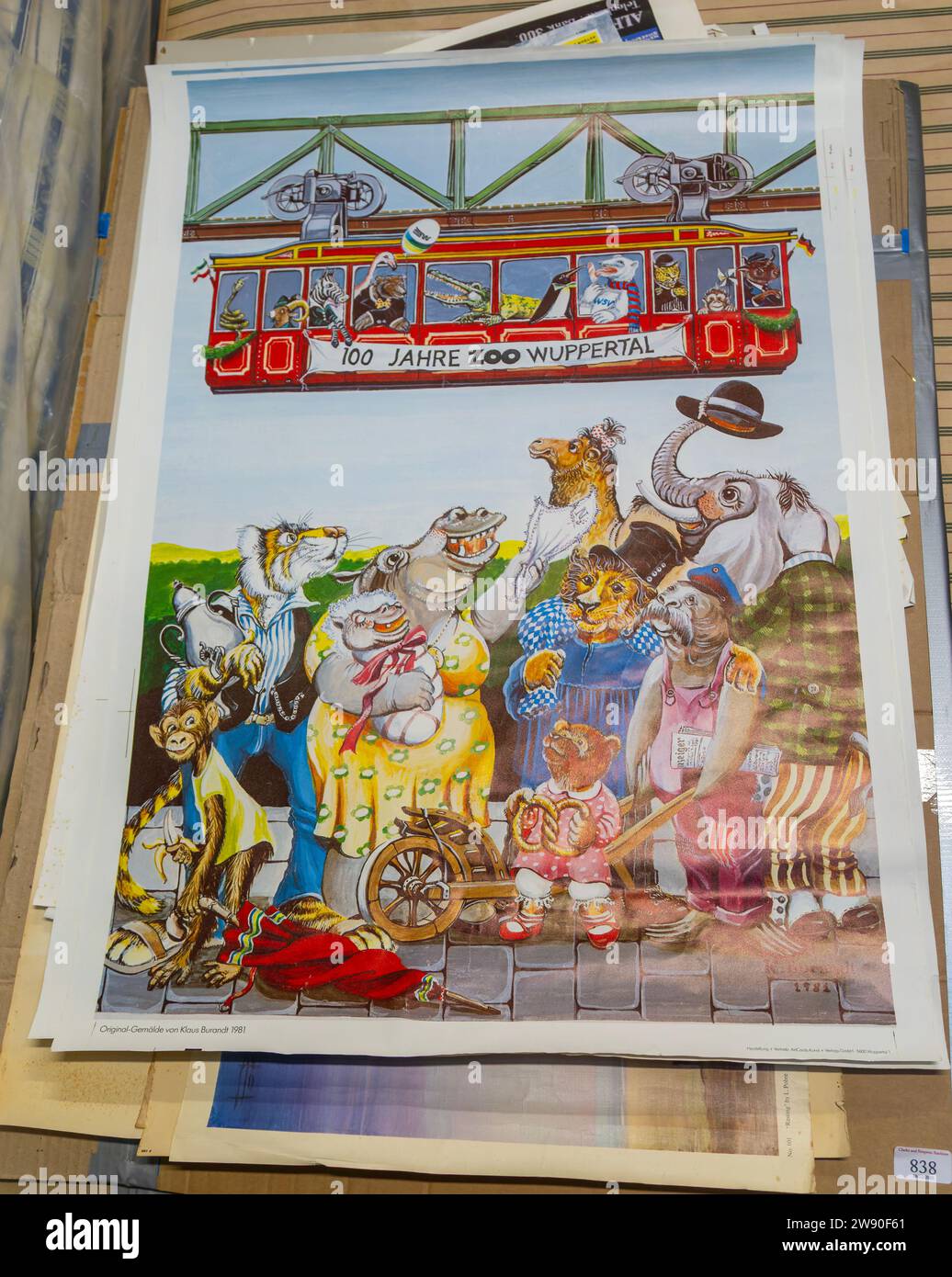 Pile of vintage posters on sale at auction - 100 years of Wuppertal zoo cartoon animals and Schwebebahn railway system 1981 Stock Photo