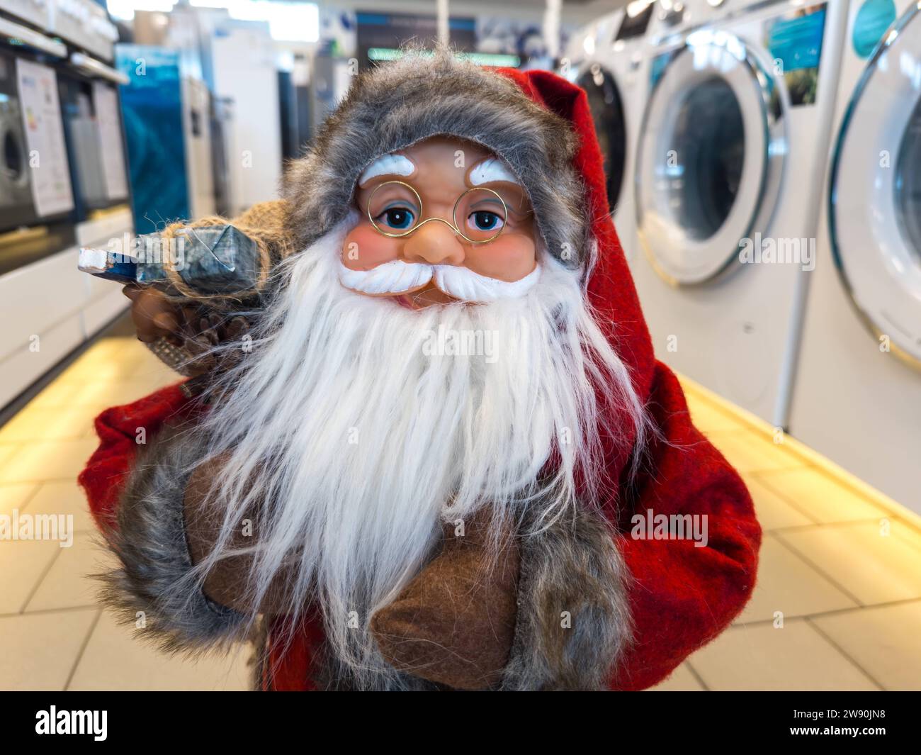 Augsburg, Bavaria, Germany - December 14, 2023: Santa Claus figure in a store. Christmas decoration in retail *** Weihnachtsmann Figur in einem Geschäft. Weihnachtsdekoration im Einzelhandel Stock Photo