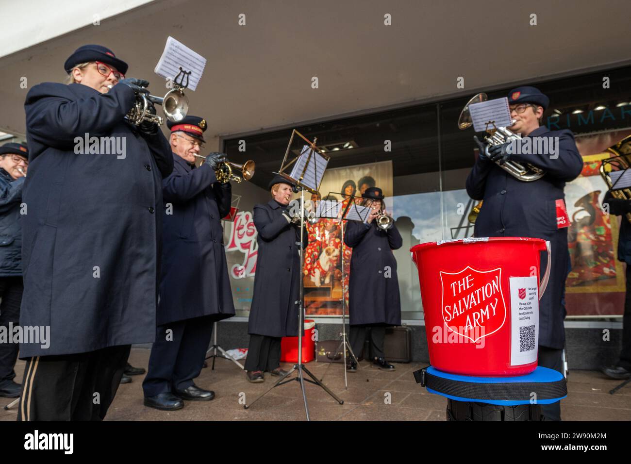 Coventry, West Midlands, UK. 23rd Dec, 2023. Coventry city centre was very busy with shoppers buying their last minute Christmas goods today. The Salvation Army band entertained shoppers with Christmas Carols. Credit: AG News/Alamy Live News Stock Photo
