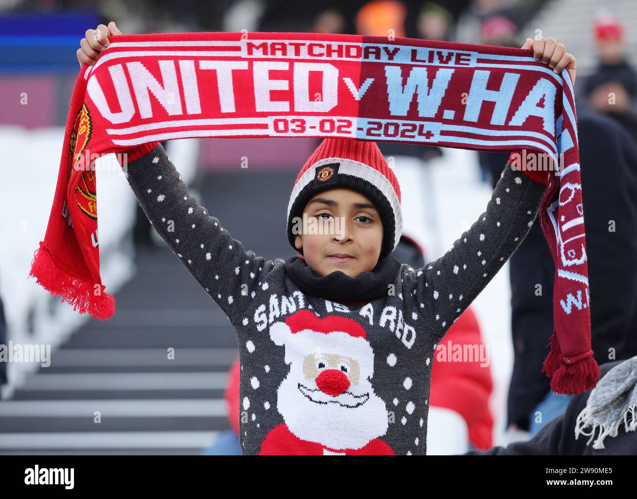 A West Ham United fan wearing a number 19 shirt with Jack Wilshere