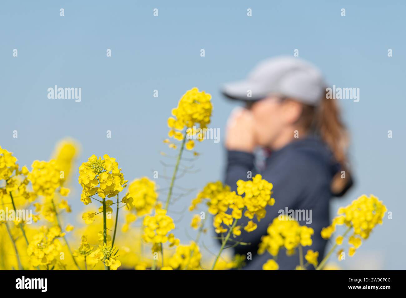 woman suffering from pollen allergy while  training outdoors Stock Photo