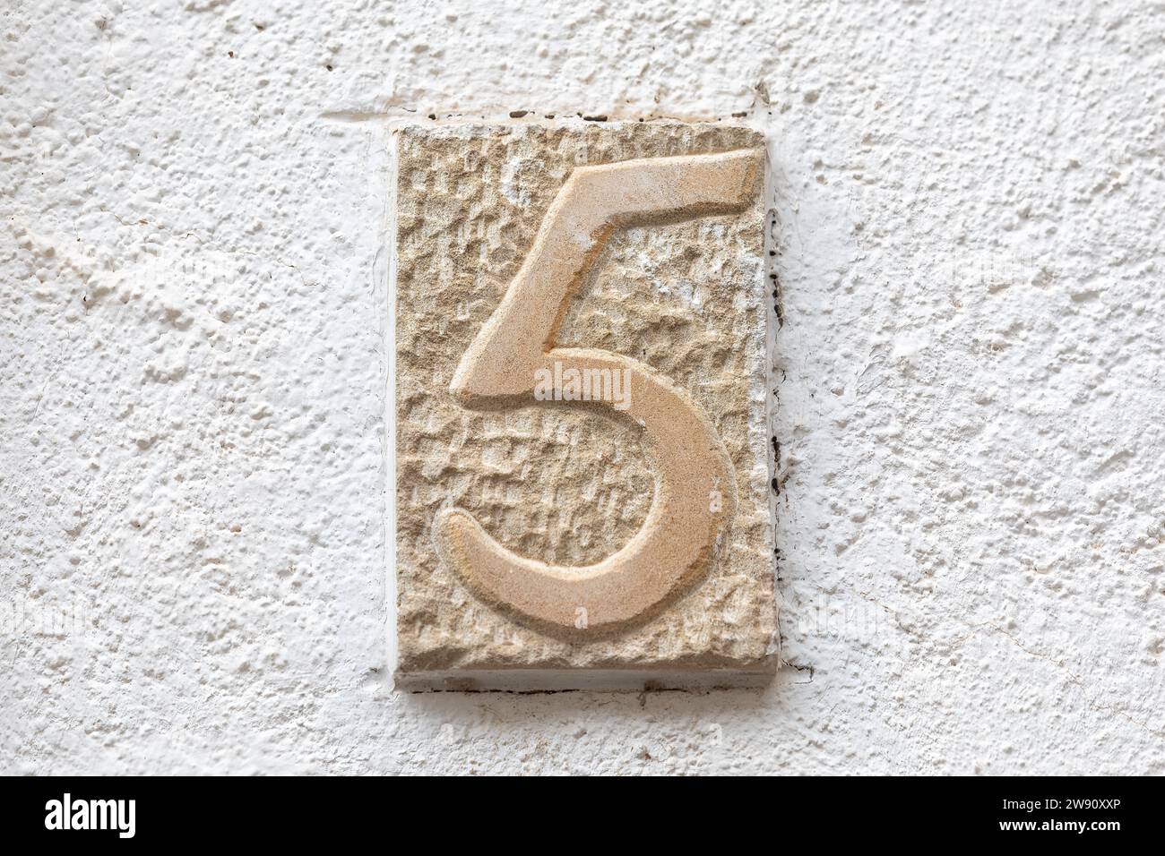 Old Weathered House Number 5, Tile on Wall Stock Photo