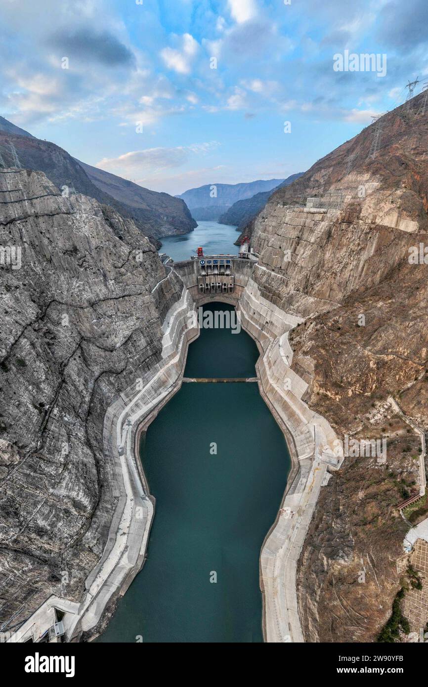 Kunming. 22nd Dec, 2023. This aerial photo taken on Dec. 22, 2023 shows the Wudongde hydropower station on the border of Sichuan and Yunnan provinces in southwest China. Wudongde hydropower station is a major national project to implement China's west-to-east power transmission program. Credit: Hu Chao/Xinhua/Alamy Live News Stock Photo