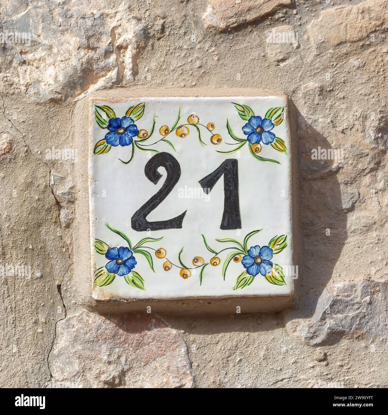 Number 21 House Tile on Wall Stock Photo