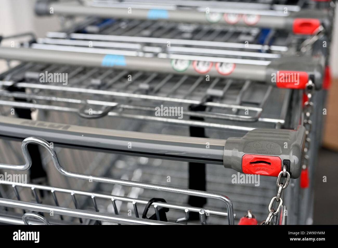 Shopping trolleys with locking coin slot to encourage return of trolley Stock Photo