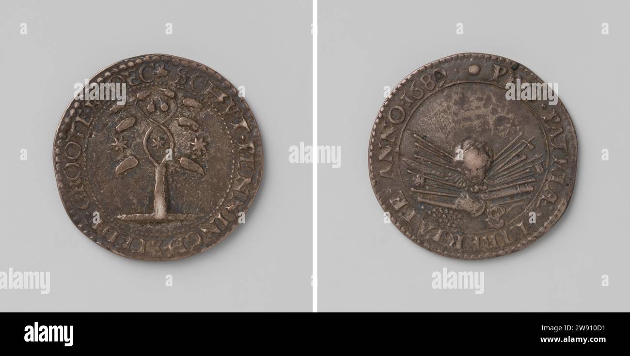 Schutterij van Grootebroek, Anonymous, 1689  Silver medal. Front: tree with branches braided; in Elips star formed by branches; On either side of it: stars within Kerschrift. Reverse: head in the pipeline Wapentuit within Covering Grootebroek silver (metal) striking (metalworking)  Grootebroek Stock Photo
