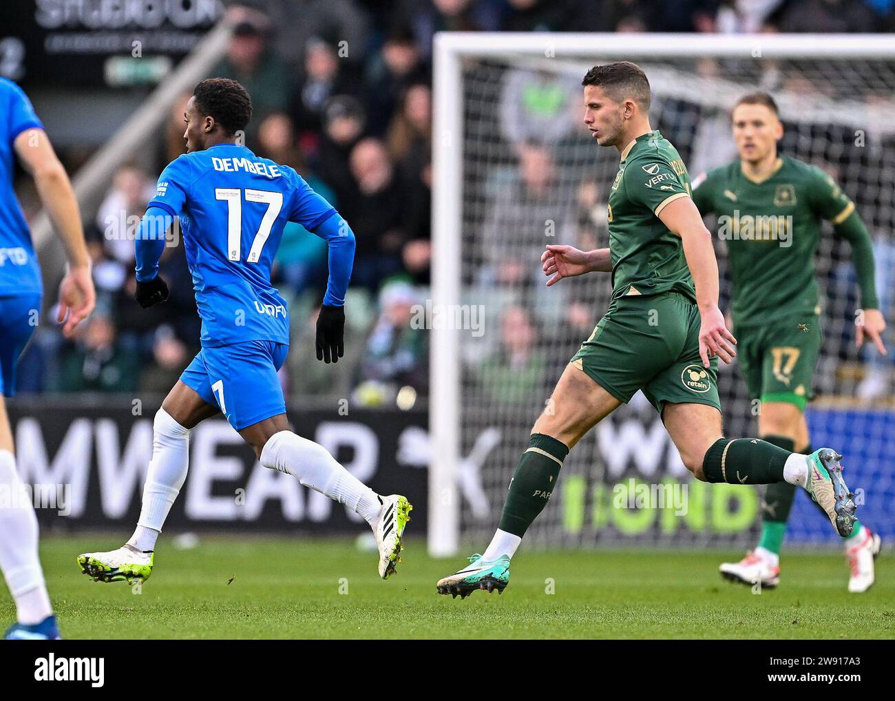 Jordan Houghton 4 of Plymouth Argyle defending during the Sky Bet