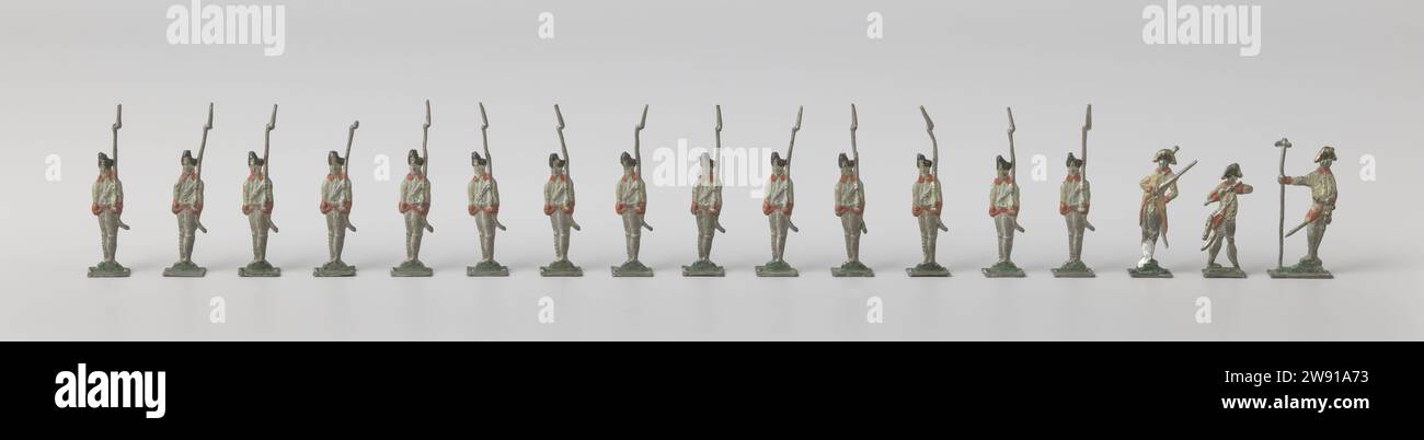 Pewter soldiers from the end of the 18th century, 1775 - 1800 toy. miniature Collection of pewter figures, consisting of 14 soldiers in posture with a rifle with bayonet on the shoulder, one piper, one ensign (broken down), and one officer. Colored in white, red and black. Germany (possibly) tin (metal) casting Stock Photo