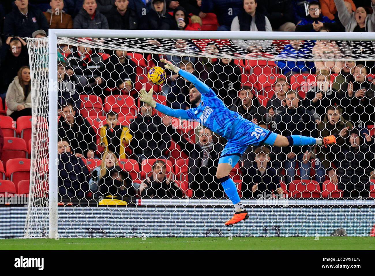 Stoke On Trent, UK. 23rd Dec, 2023. Matija Sarkic #20 of Millwall makes a save during the Sky Bet Championship match Stoke City vs Millwall at Bet365 Stadium, Stoke-on-Trent, United Kingdom, 23rd December 2023 (Photo by Conor Molloy/News Images) in Stoke-on-Trent, United Kingdom on 12/23/2023. (Photo by Conor Molloy/News Images/Sipa USA) Credit: Sipa USA/Alamy Live News Stock Photo