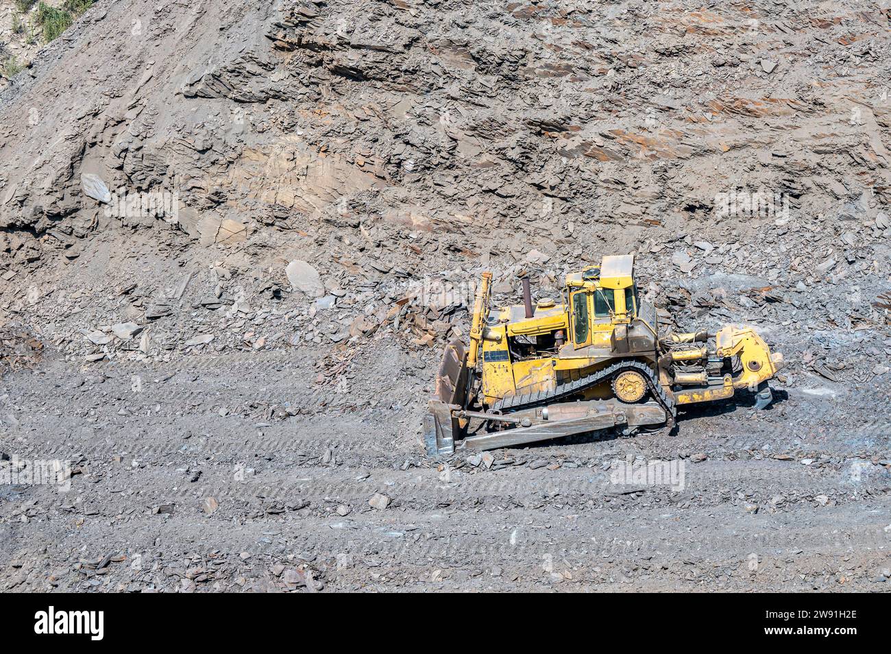 Heavy machinery in the process of mountain road construction works in Saudi Arabia Stock Photo