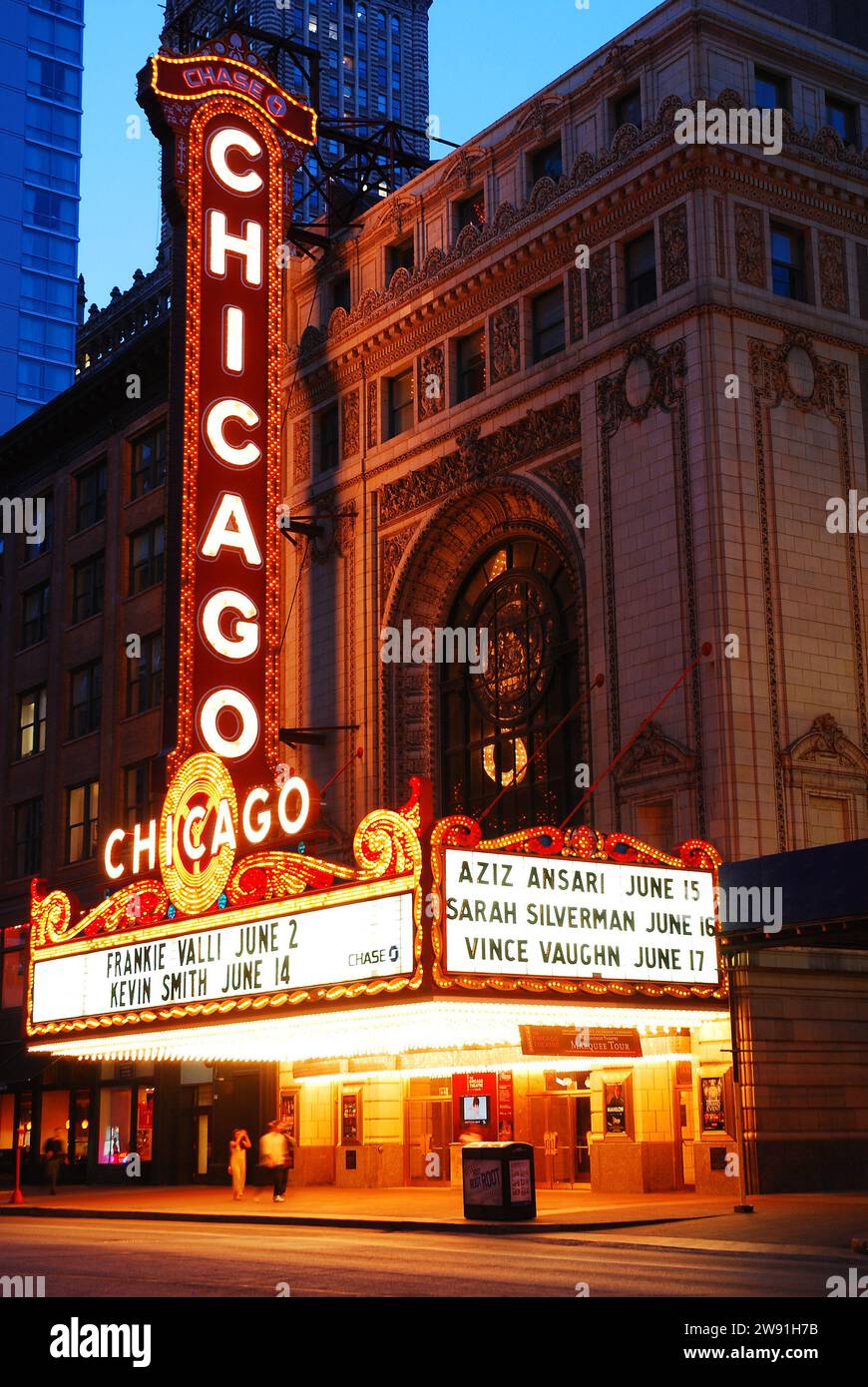 The Marquee of the historic Chicago Theater lights up the streets in the Loop district Stock Photo