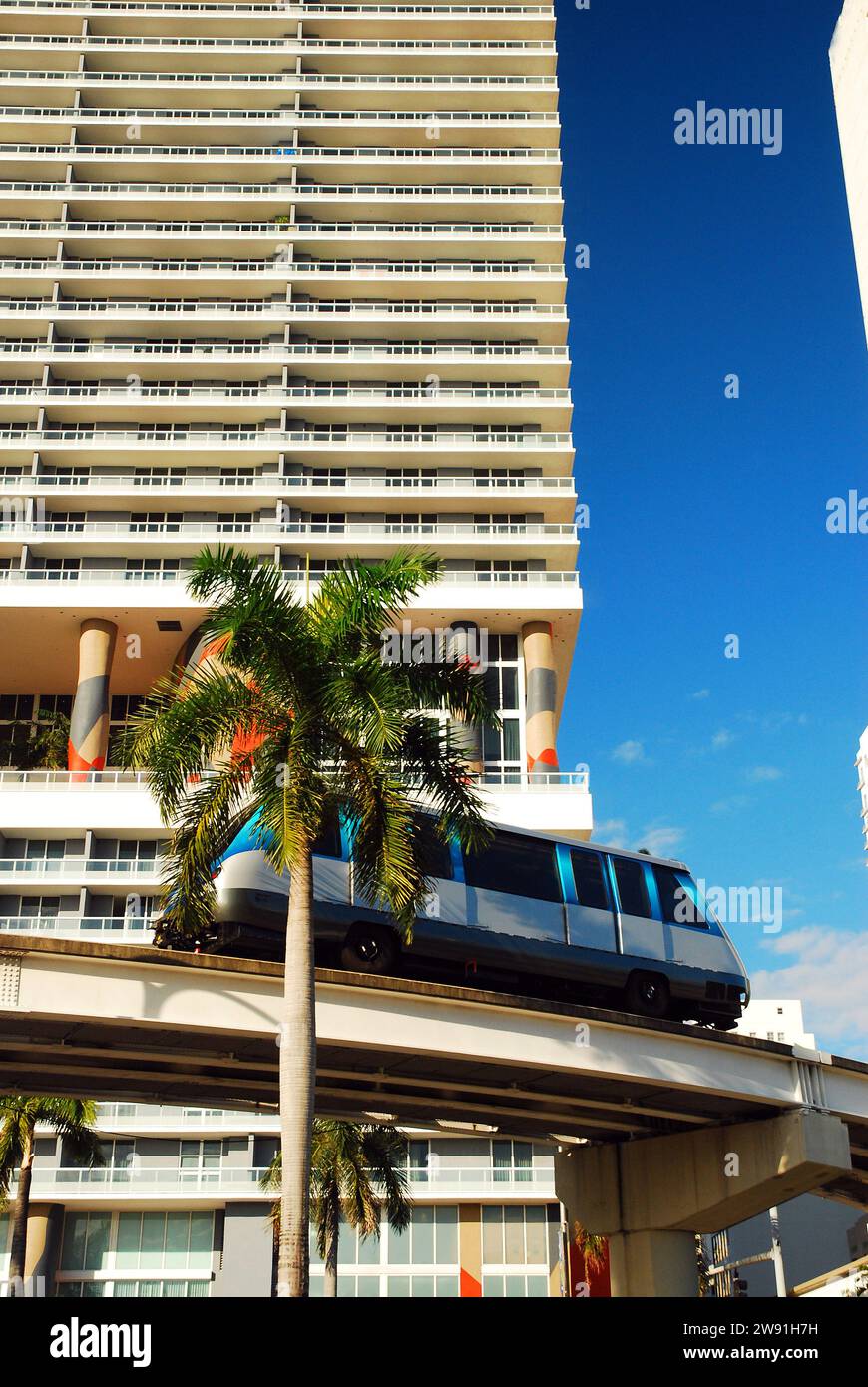 The Metromover monorail glides through downtown Miami, going between the buildings and bringing the passengers to their jobs Stock Photo