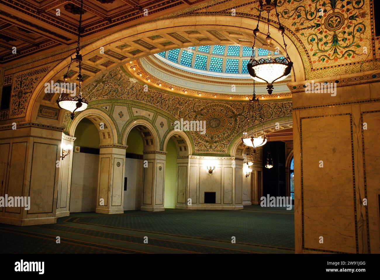 The Tiffany Designed stained glass window stands over the atrium and