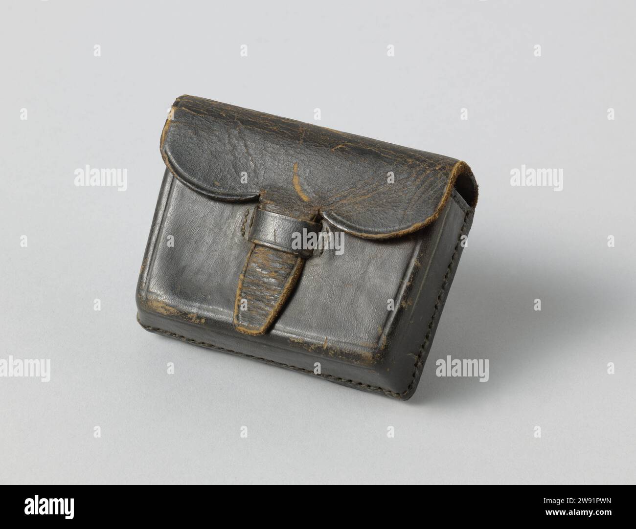 Pouch for Percussion Caps, anonymous, 1868 bag Small leather bag, lined with black-brown fur. The flap is closed with a tongue by a strap; At the rear two loops in front of the belt. Netherlands leather. Stock Photo