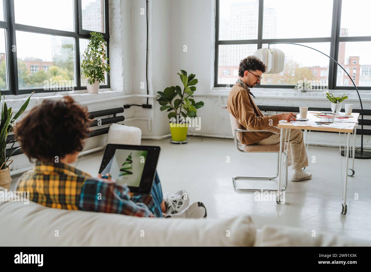 Young graphic designers working together at office Stock Photo