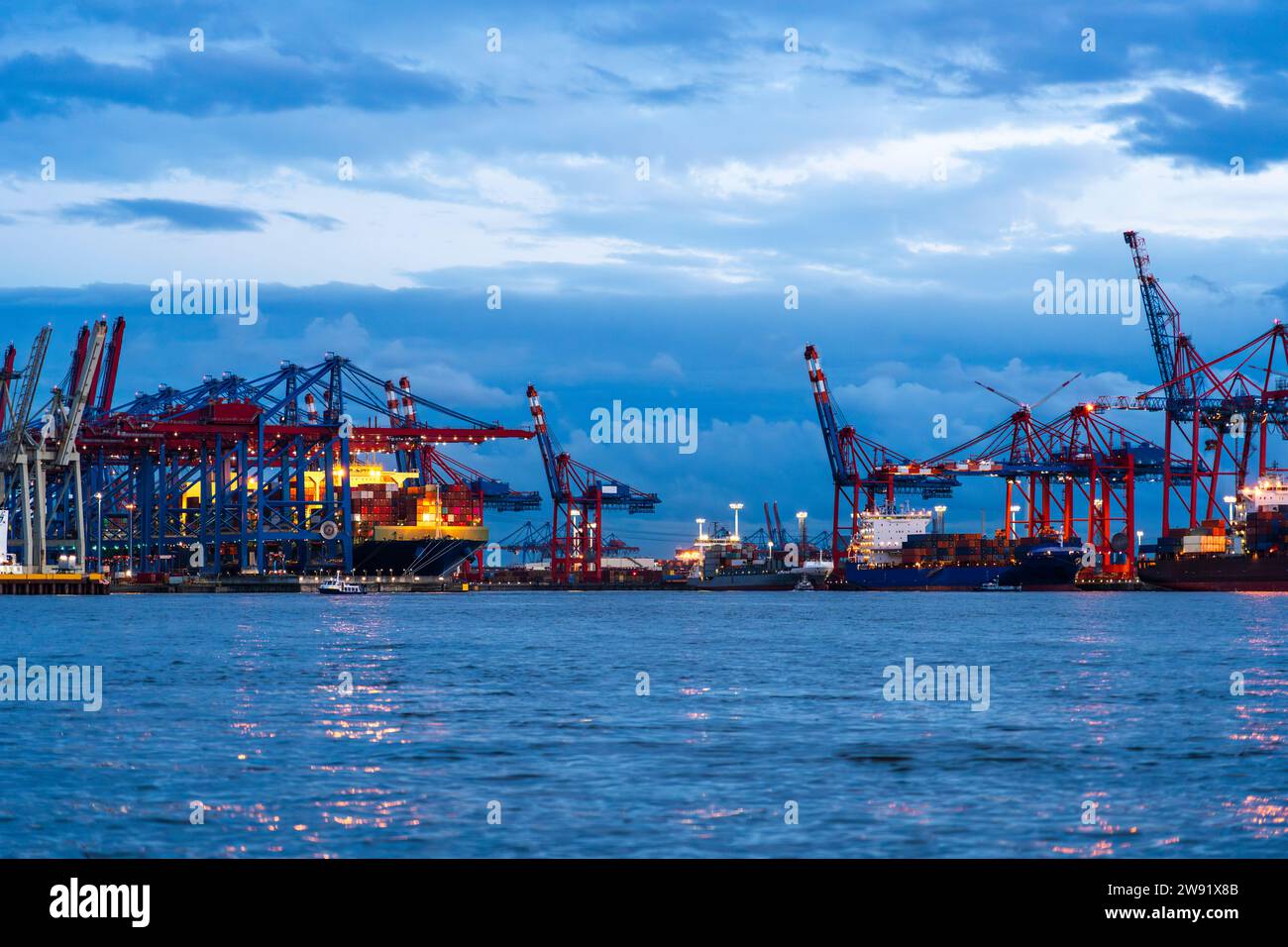 Germany, Hamburg, Container terminals Burchardkai and Eurogate in Port of Hamburg at dusk Stock Photo