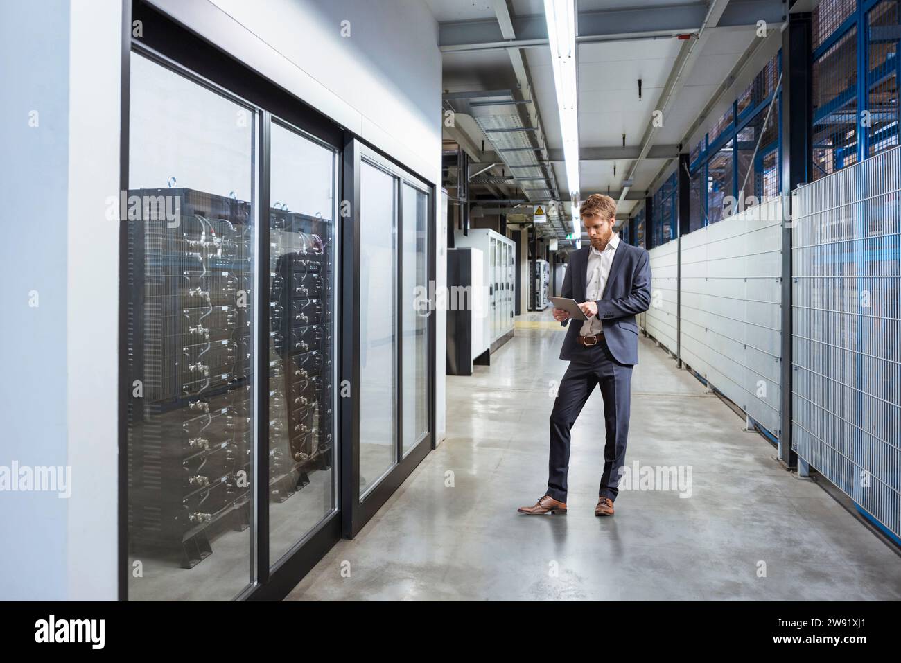 Manager using tablet PC at industry Stock Photo