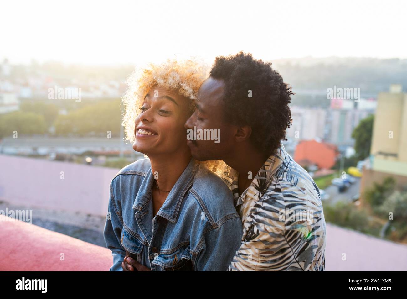 Romantic boyfriend embracing transgender woman on sunset Stock Photo ...