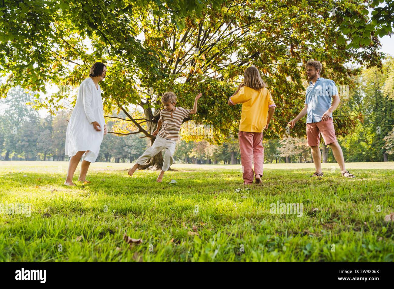 Happy child playing park grass hi-res stock photography and images - Alamy