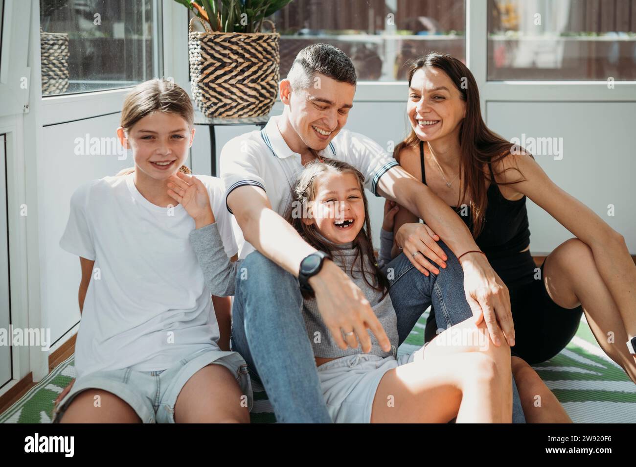 Portrait happy family sitting in hi-res stock photography and images ...