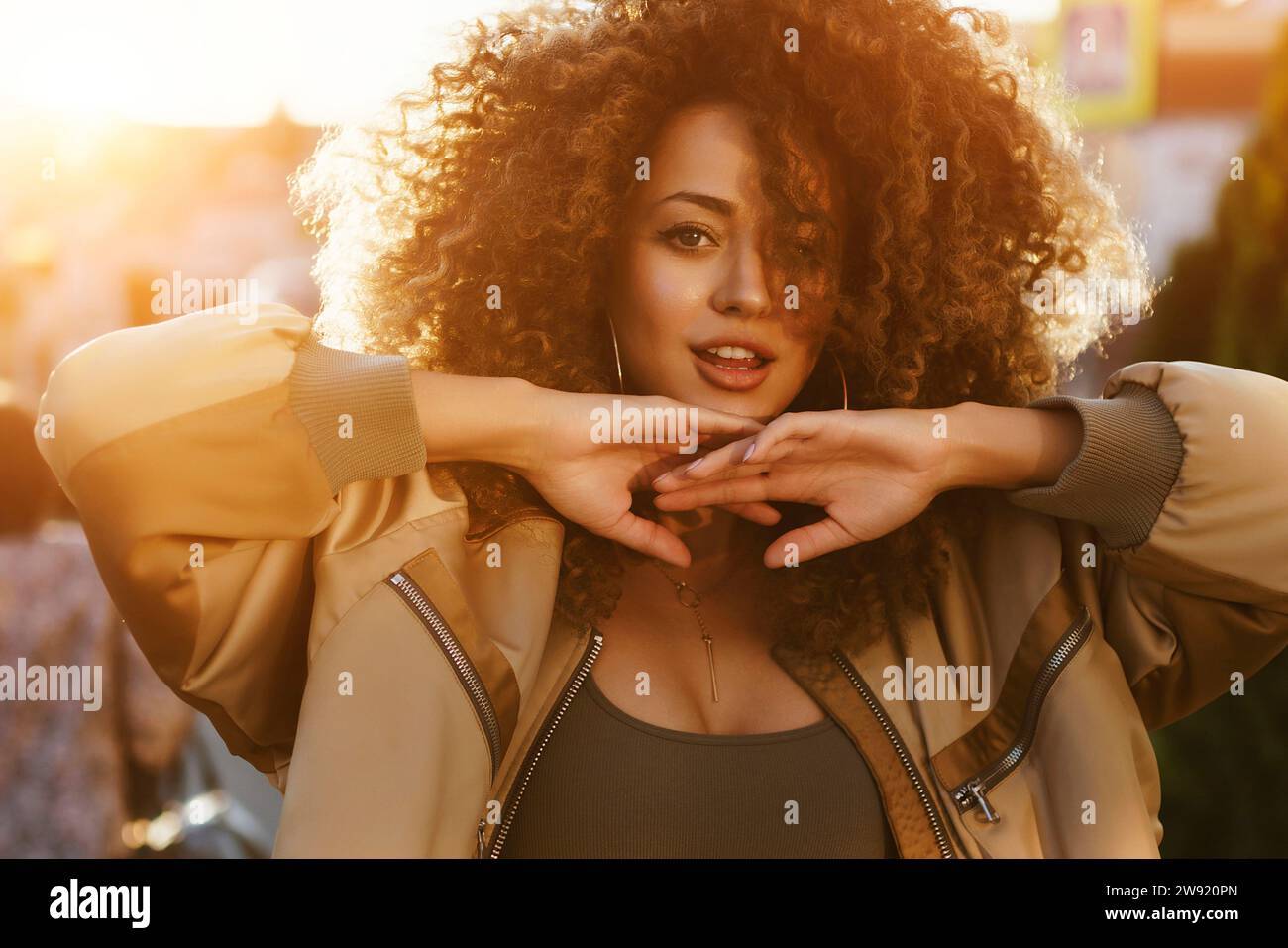 Happy carefree woman curly hi-res stock photography and images - Alamy