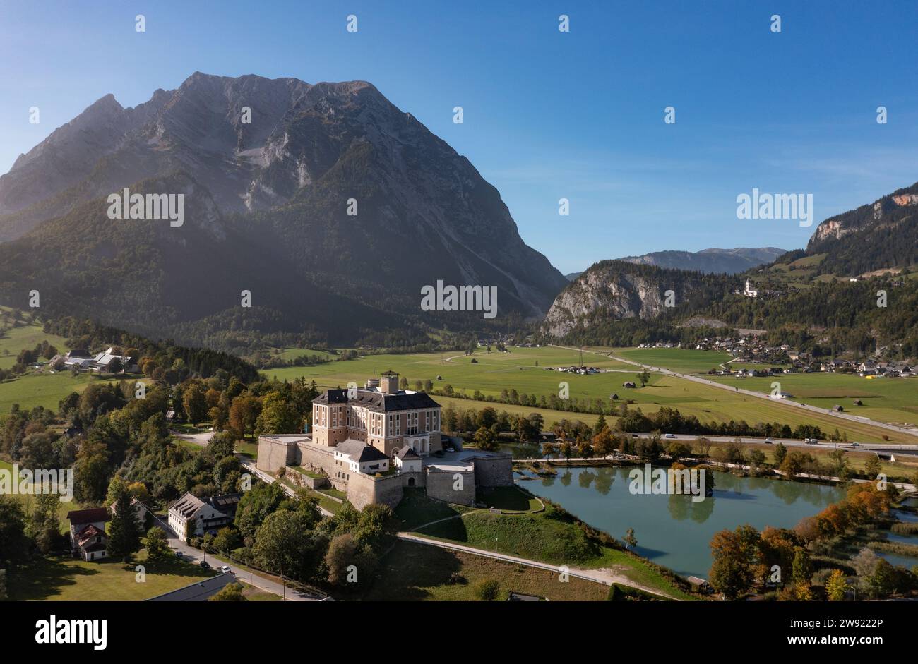 Austria, Styria, Stainach-Purgg, Drone view of Trautenfels Castle and Grimming peak Stock Photo