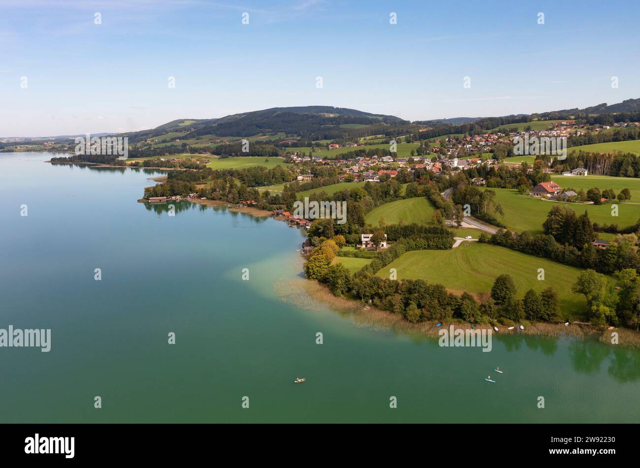 Austria, Upper Austria, Zell am Moos, Drone view of village on shore of Irrsee lake Stock Photo
