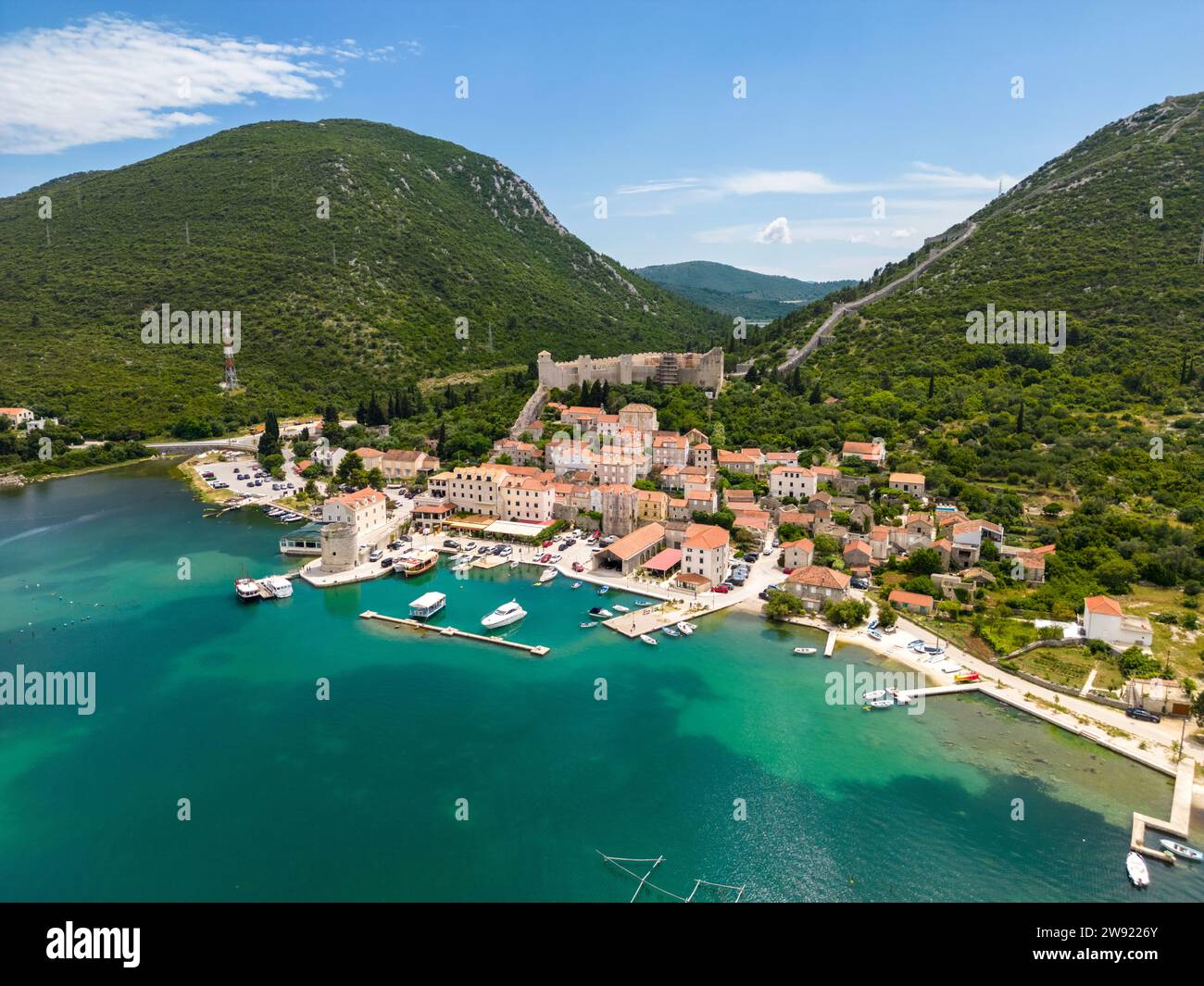 Croatia, Dubrovnik-Neretva County, Mali Stron, Aerial view of coastal village and surrounding mountains in summer Stock Photo