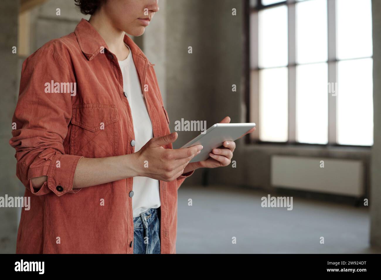 Engineer using tablet PC at construction site Stock Photo