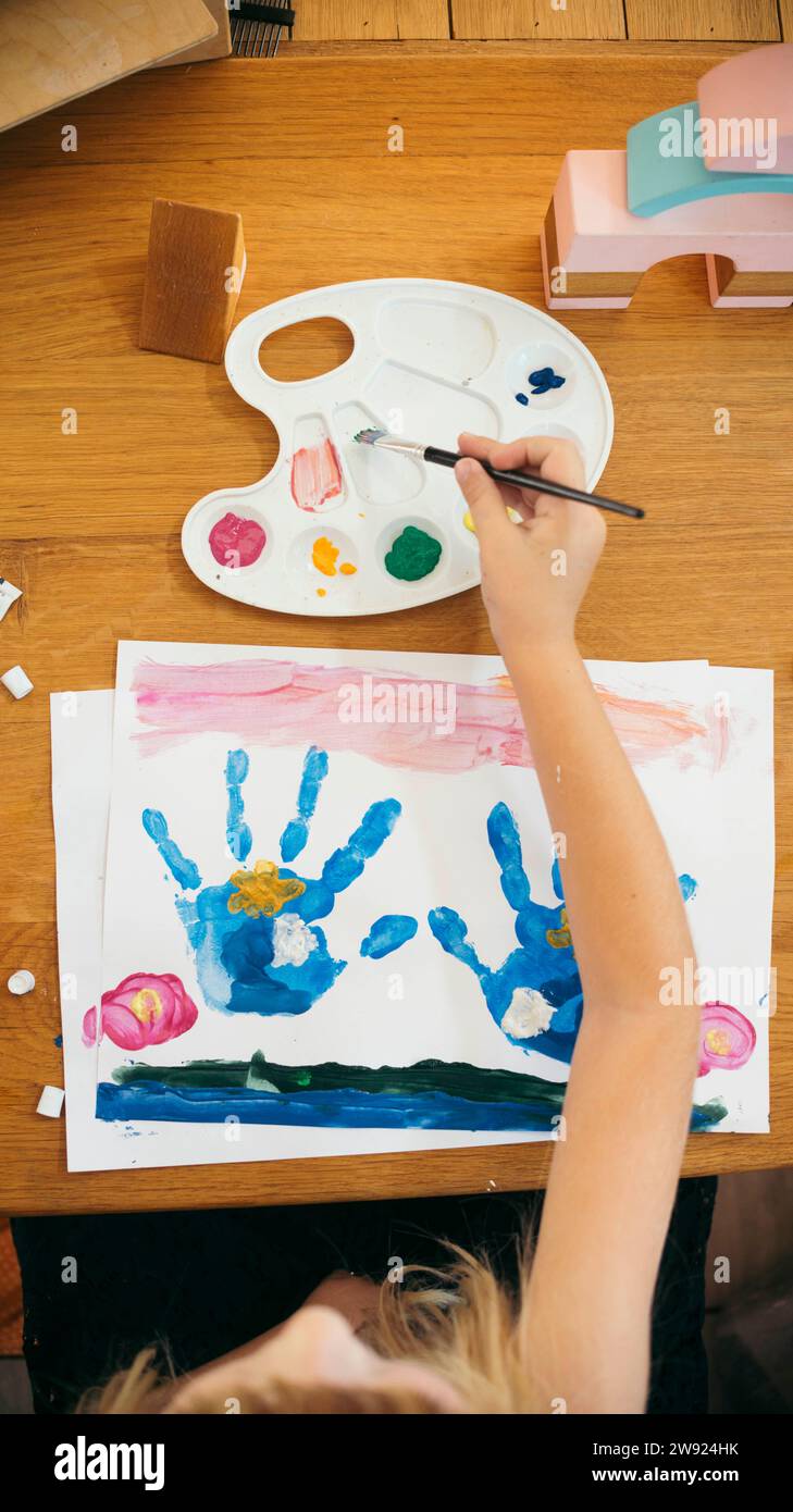 Girl painting with watercolor at home Stock Photo Alamy
