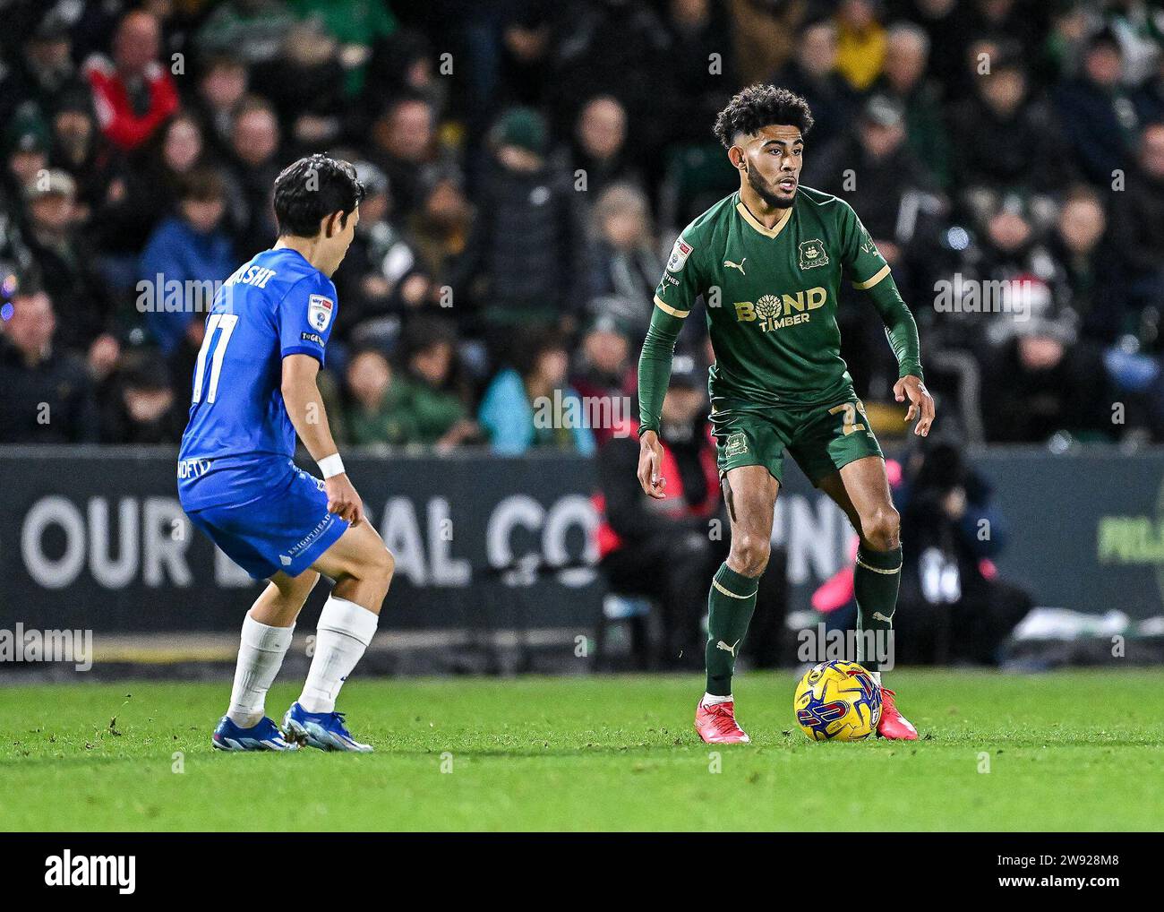 Kaine Kesler Hayden 29 of Plymouth Argyle looks for pass during the