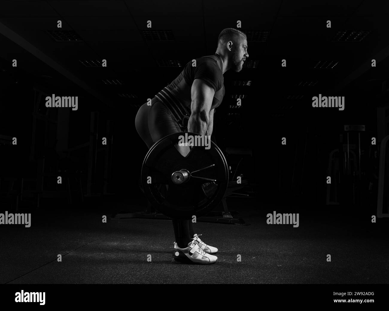 The weightlifter performs an exercise called deadlift. He fixed the weight Stock Photo