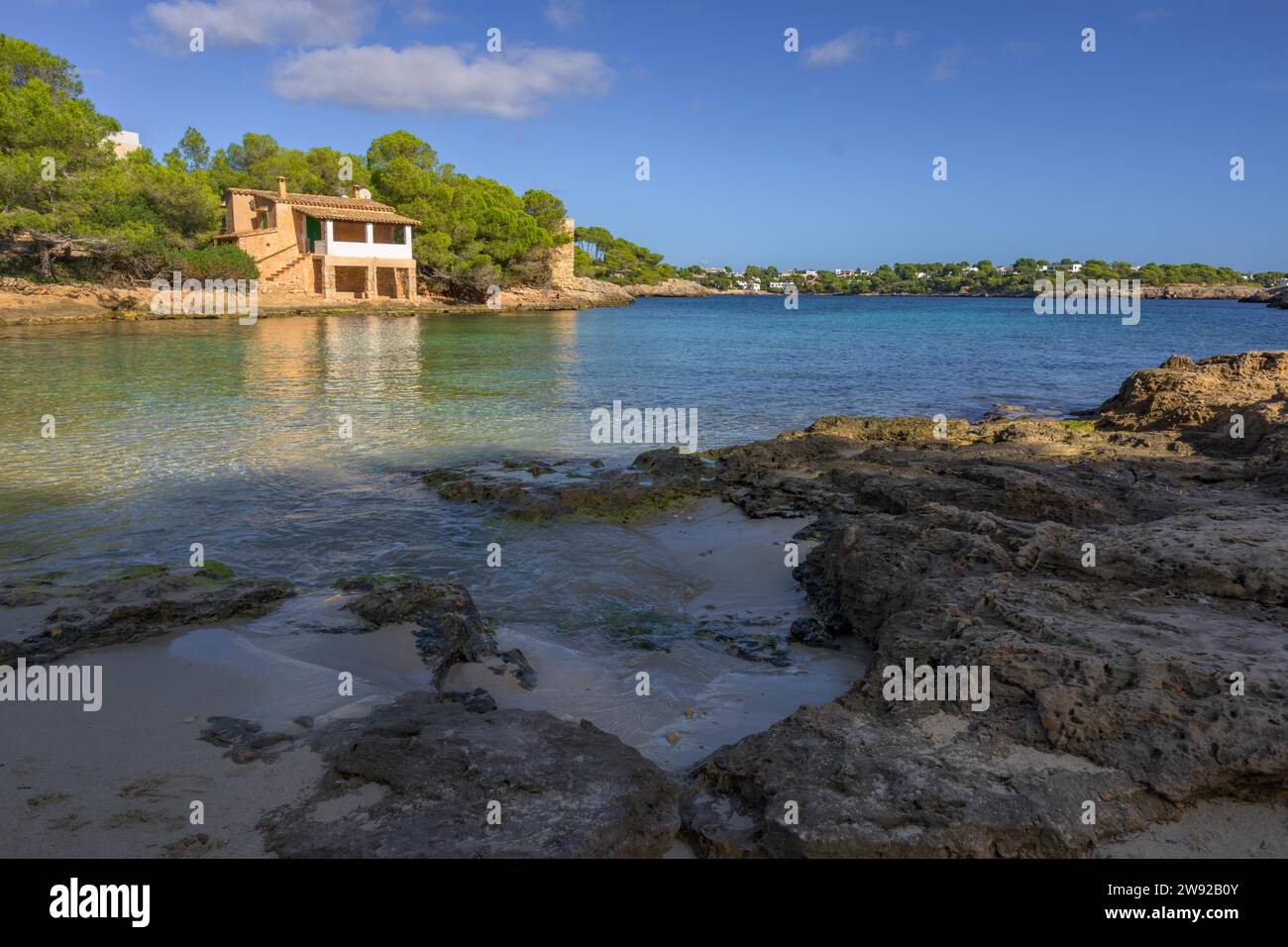 View of a small pier typical of the mediterranean beaches Stock Photo