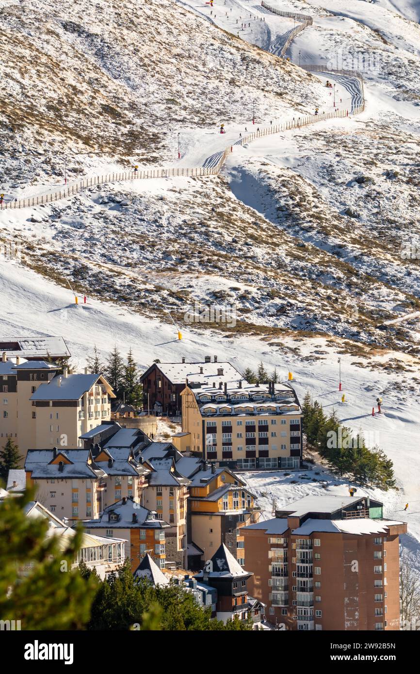 Aerial view of ski resort hotels and slopes with skiers, sierra nevada