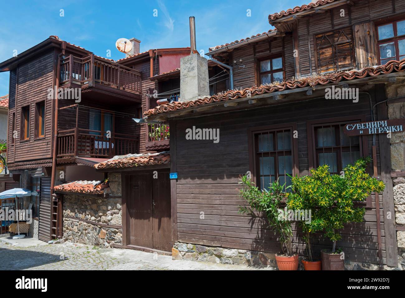 traditional-wooden-houses-with-balconies-under-a-blue-sky-accompanied