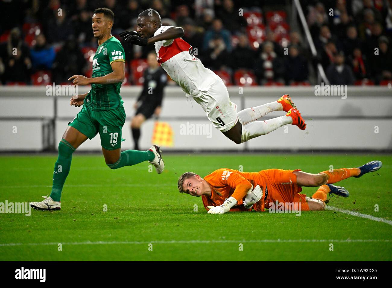 Serhou Guirassy VfB Stuttgart (09) flies through the air after a duel