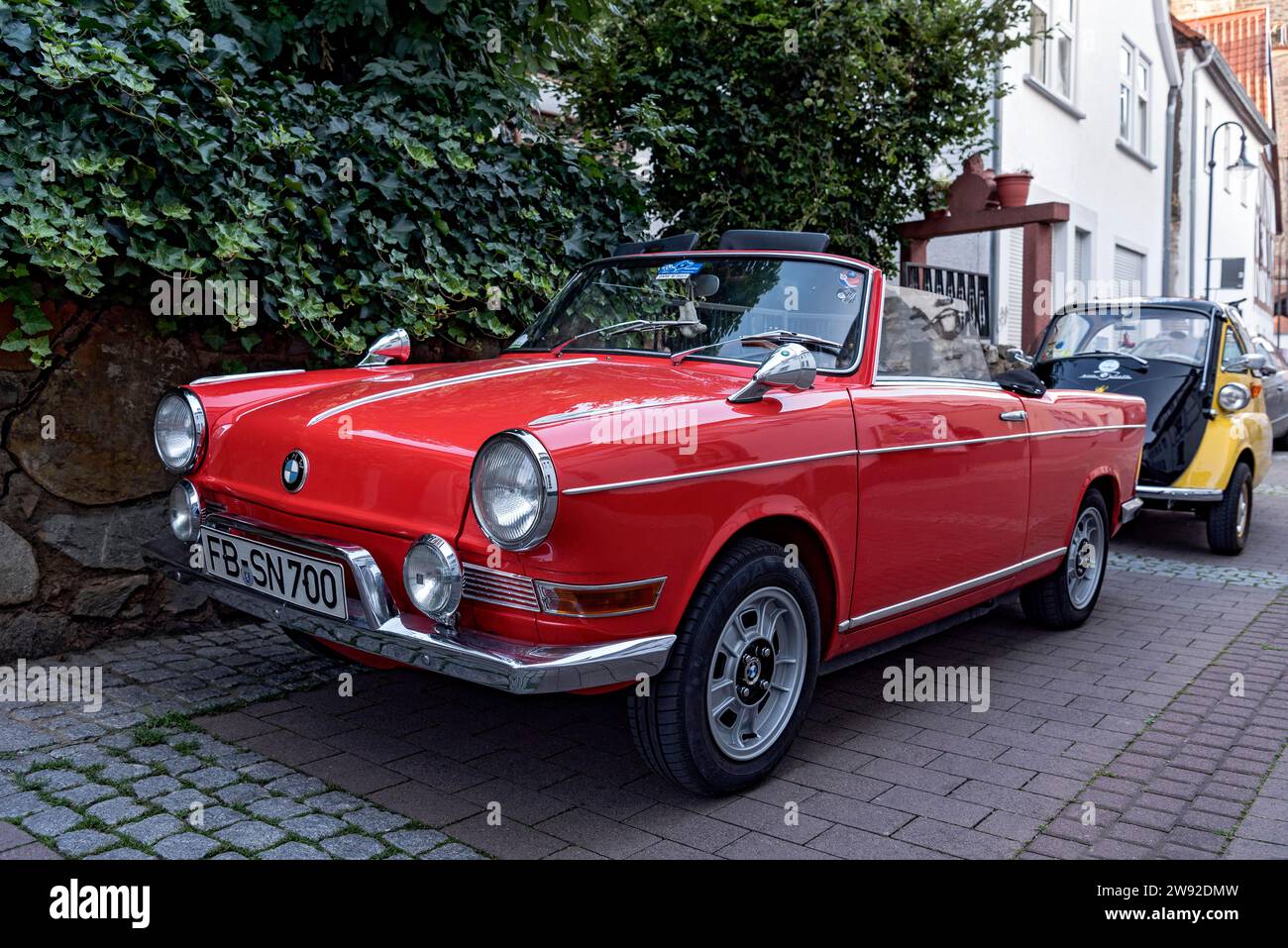 Oldtimer BMW 700 Cabriolet, convertible, small car, year of construction 1959 to 1965, behind it scooter Isetta 300, Friedberg, Wetterau, Hesse Stock Photo