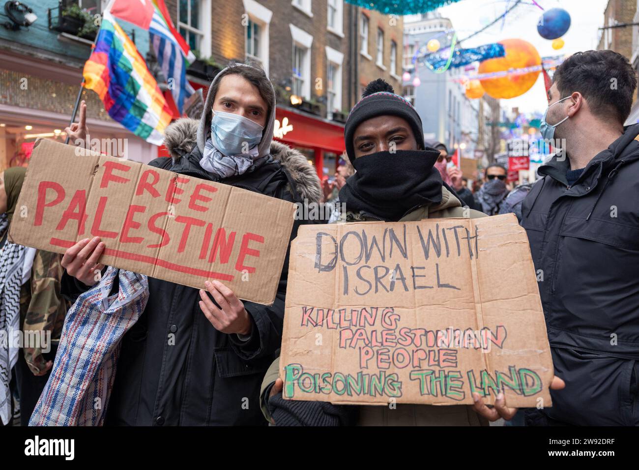 London / UK  23 DEC 2023. Hundreds of people demonstrated in Carnaby street in London, calling for an immediate ceasefire in Gaza and a boycott of “Israel-linked” brands. Aubrey Fagon / Alamy Live News Stock Photo