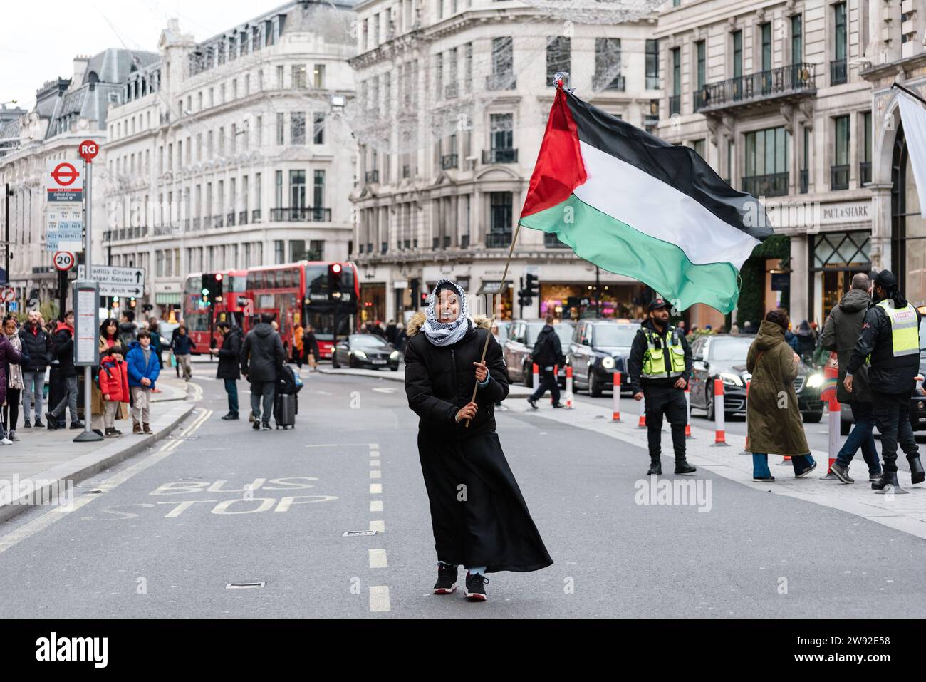 London, UK. 23 December 2023. March organised by Sisters Uncut in support of Palestine. Hundreds march through Oxford Street and Carnaby Street to call for a ceasefire in Gaza and a boycott of high street brands with links to Israel. Credit: Andrea Domeniconi/Alamy Live News Stock Photo