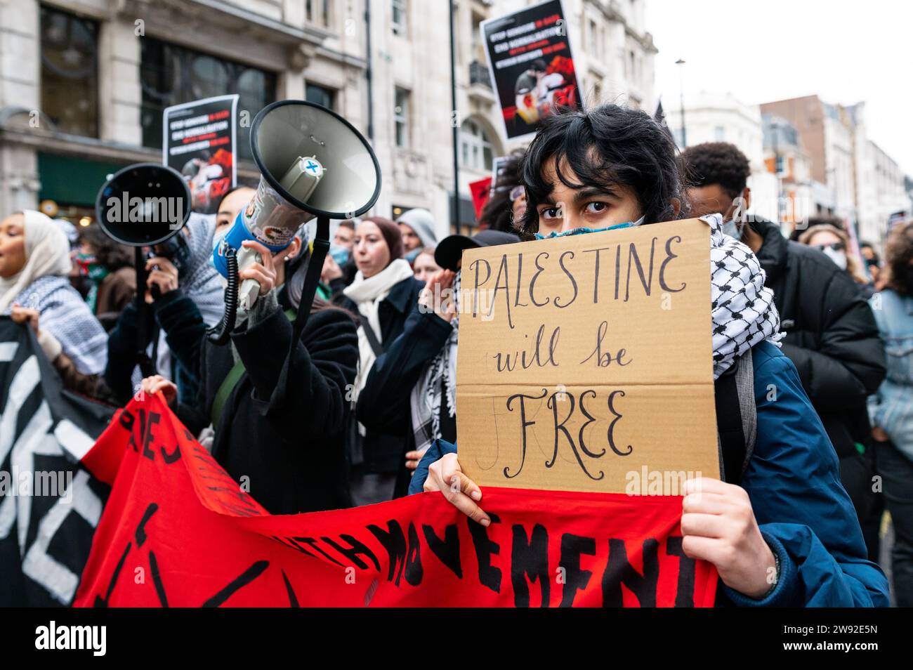 London, UK. 23 December 2023. March organised by Sisters Uncut in support of Palestine. Hundreds march through Oxford Street and Carnaby Street to call for a ceasefire in Gaza and a boycott of high street brands with links to Israel. Credit: Andrea Domeniconi/Alamy Live News Stock Photo