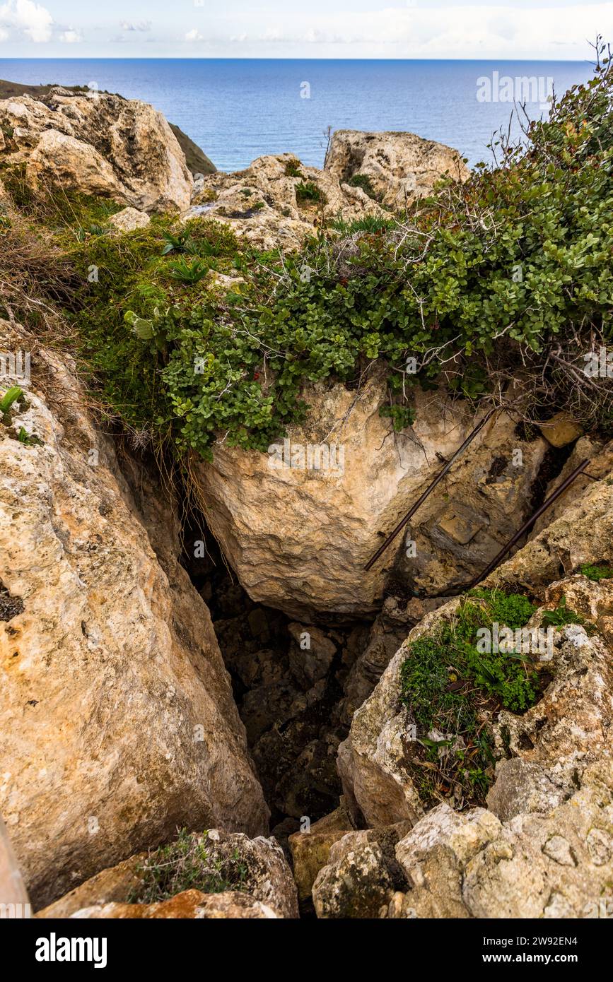 On the island of Gozo above Ramla Bay is the "Calypso Cave", which is believed to correspond to the mythological island of Ogygia described by Homer. Xaghra, Malta Stock Photo