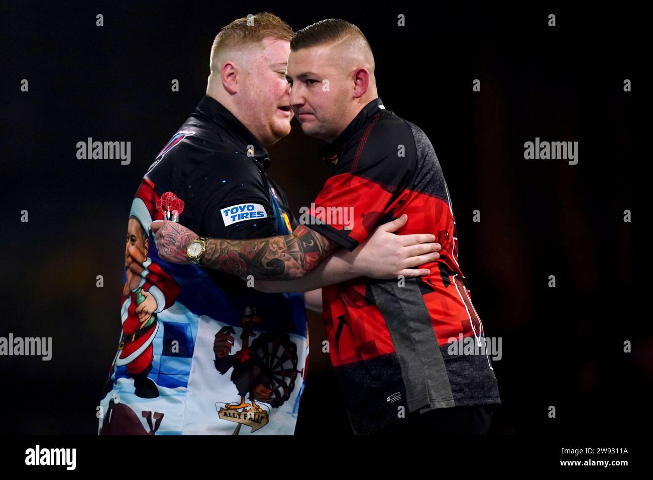 Nathan Aspinall (right) congratulates Ricky Evans on his victory on day