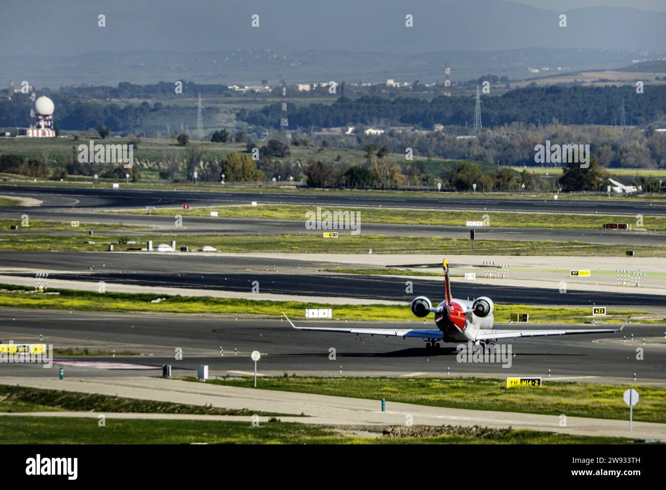 A jet plane intended for regional travel ready to approach the take-off runway Stock Photo